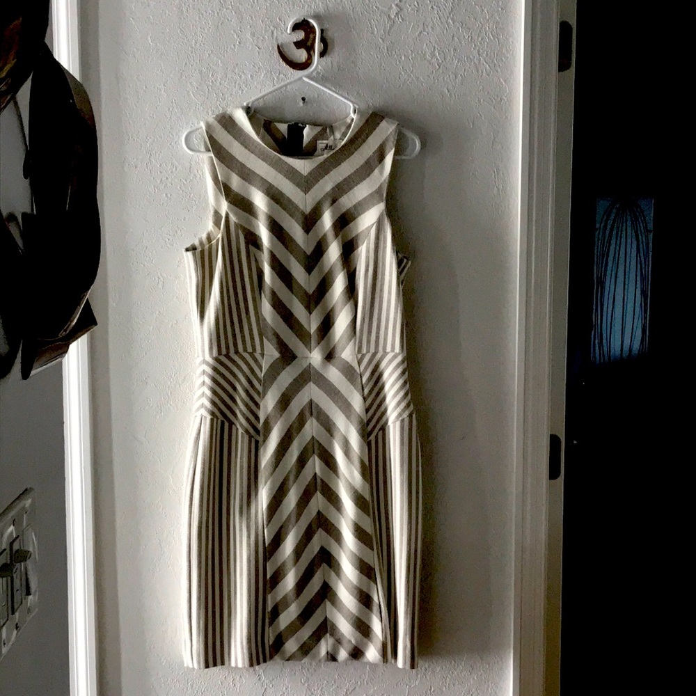 Tailored form fitting dress of imported material